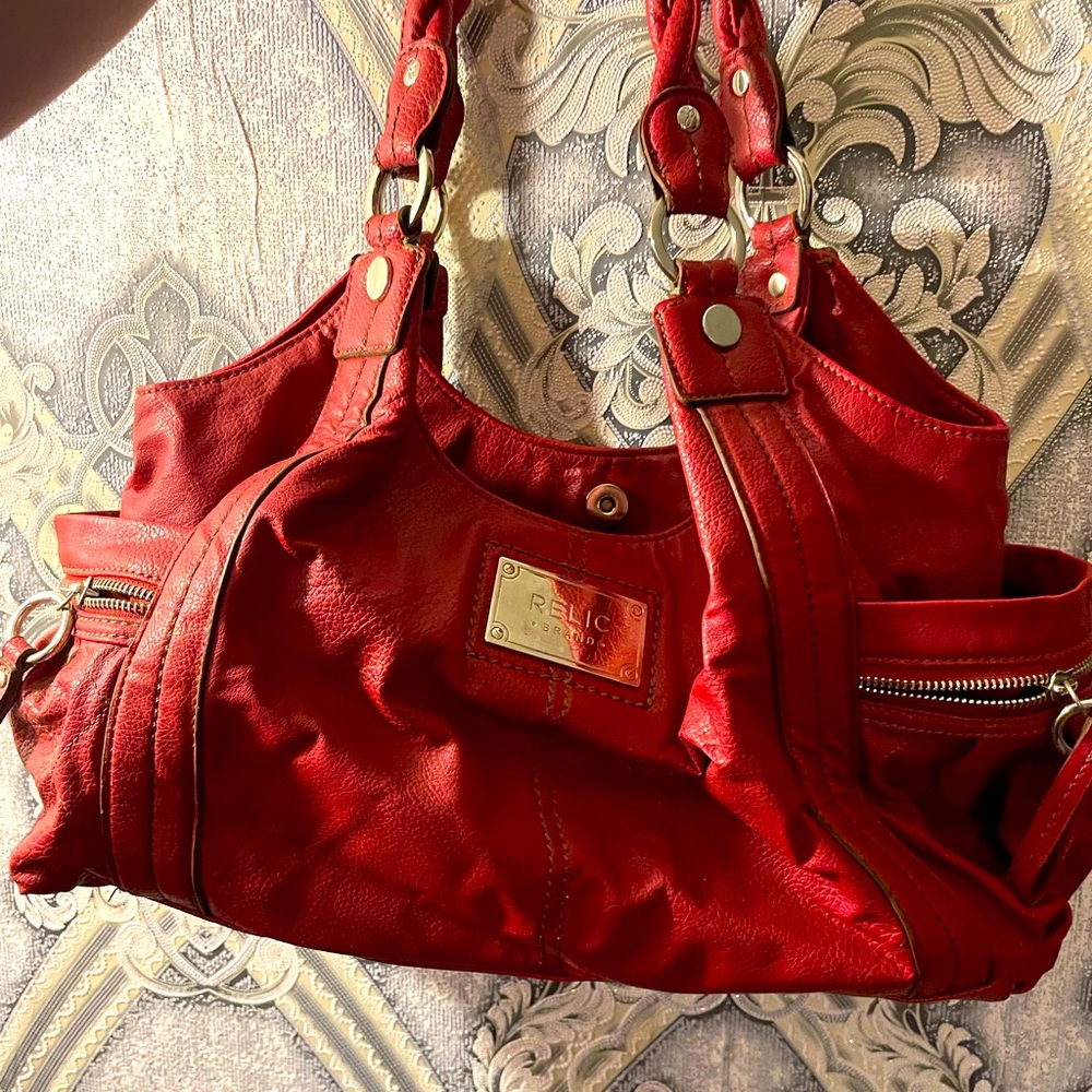 Relic red leather like purse with leopard print accents on inside